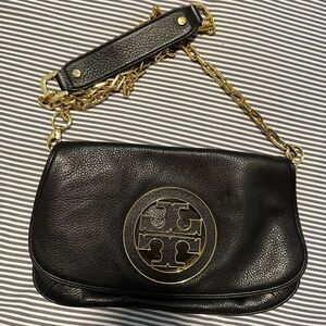 Black Tory Burch crossbody bag with gold hardware.